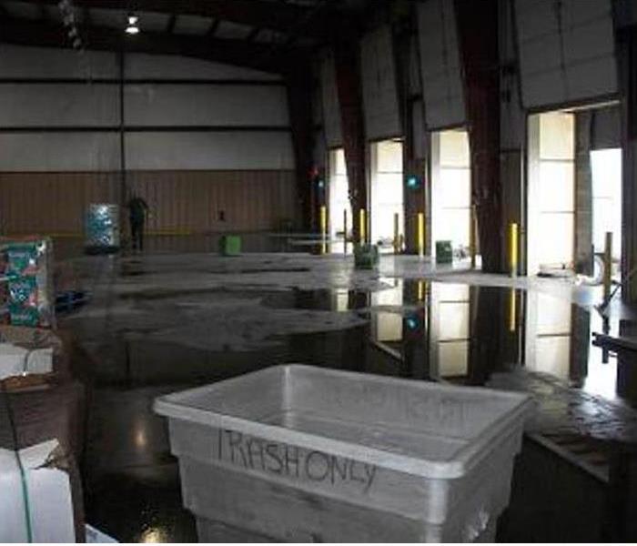 water pooling on concrete pad of warehouse