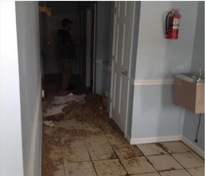 debris and sewage in a hallway, water fountain