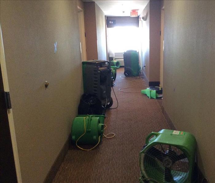 drying equipment in corridor of hotel, carpet flooring